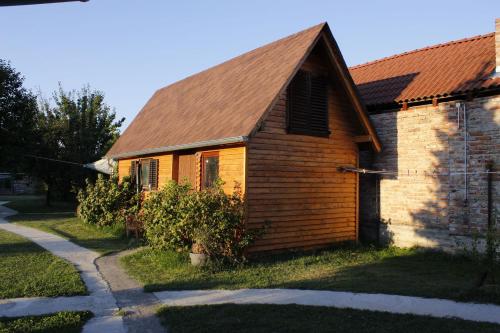an old brick church with a brown roof at Apartments Osijek by the River in Osijek