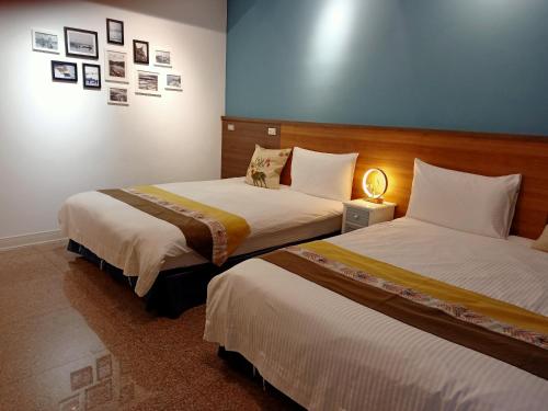 Katil atau katil-katil dalam bilik di Lu-Kang Traveler Inns