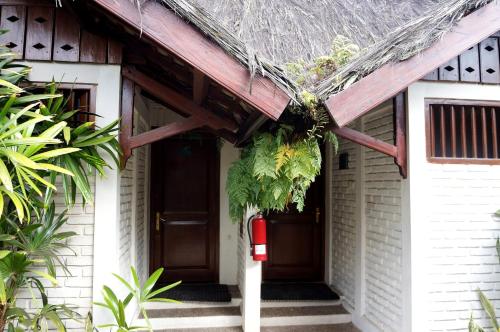 a front door of a house with a porch at Kampung Sumber Alam Garut in Garut