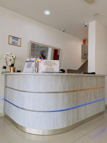 a reception counter in a restaurant with a counter at Noor Hotel Kangar in Kangar