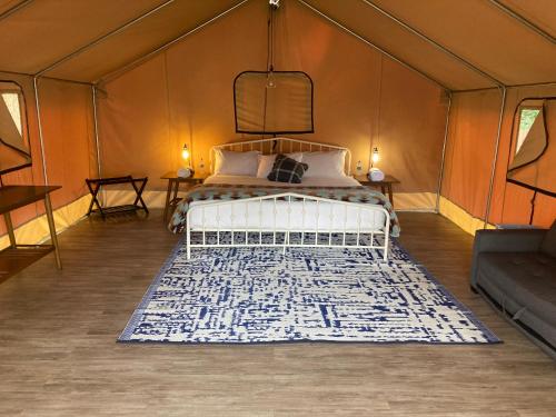 a bedroom with a bed in a tent at Pacific Dunes Resort in Copalis Beach