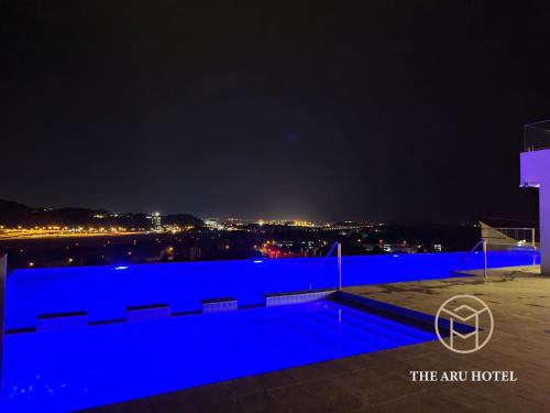 a view of the city at night at The Aru Hotel at Aru Suites in Kota Kinabalu
