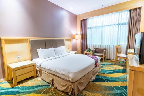 Voodi või voodid majutusasutuse Imperial Palace Hotel toas