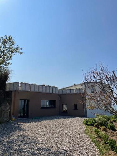 
a large brick building with a view of the ocean at Brise du Large - Maison d'Ault in Ault
