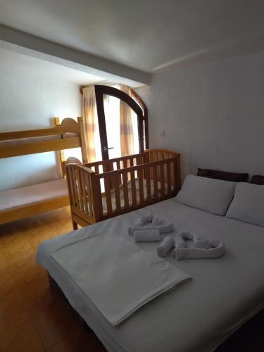 a bedroom with a bed with towels on it at Apartment Klara in Bar
