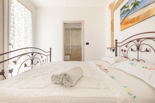 Postel nebo postele na pokoji v ubytování Salentoandmore - Villa La Macchia