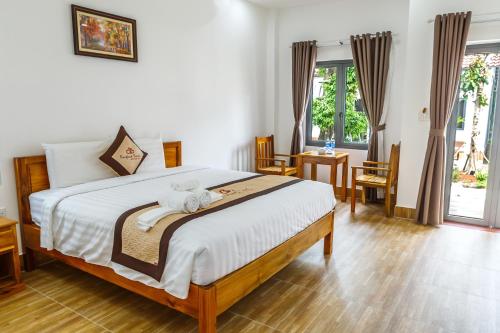 A bed or beds in a room at Rain Forest Resort Phu Quoc