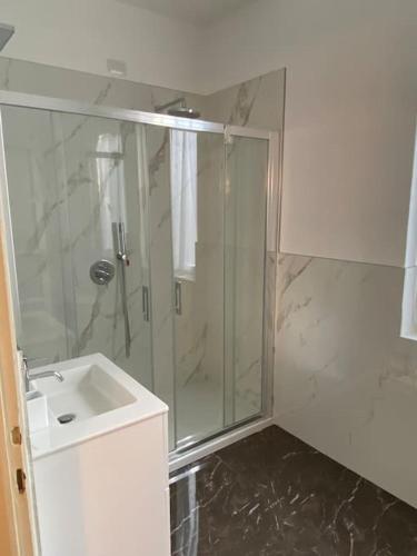 a bathroom with a shower and a sink at JUST LAKE in Bellagio
