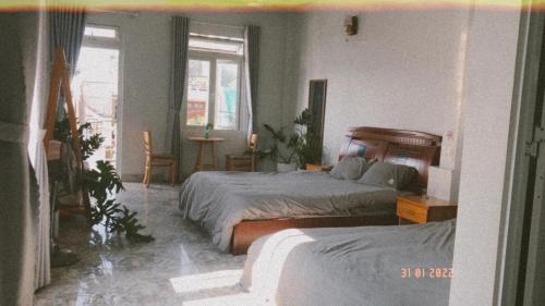 Postel nebo postele na pokoji v ubytování Rot Homestay