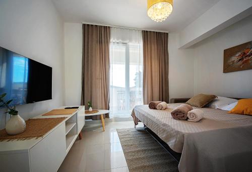 Posteľ alebo postele v izbe v ubytovaní Sea Front Apartments Ivana