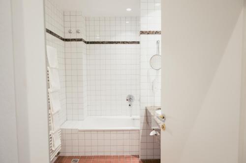 
Ein Badezimmer in der Unterkunft DOM Hotel LIMBURG

