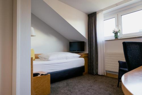 Postel nebo postele na pokoji v ubytování DOM Hotel LIMBURG