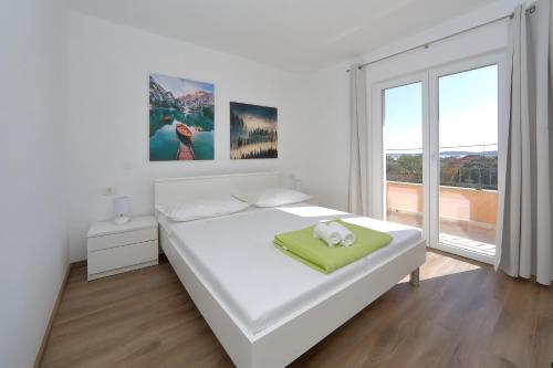 Postel nebo postele na pokoji v ubytování Apartment Alfonso