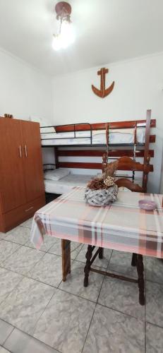 a kitchen with a table with a cross on the wall at Kostas Apartments in Kourouta