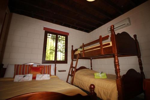 a bedroom with two bunk beds and a window at House of Roses in Limassol