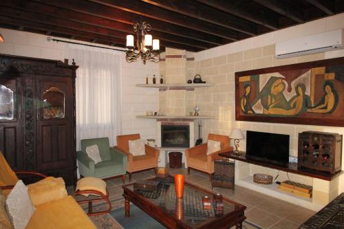a living room with a couch and a table at House of Roses in Limassol