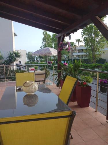 a table with a vase sitting on top of it at Cozy Home (close to the beach) in Nea Kydonia