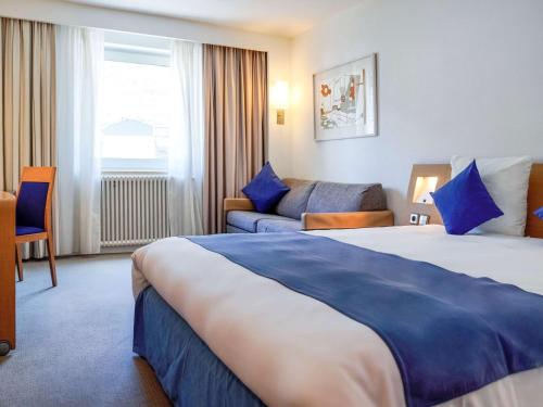 Postel nebo postele na pokoji v ubytování Novotel Andorra