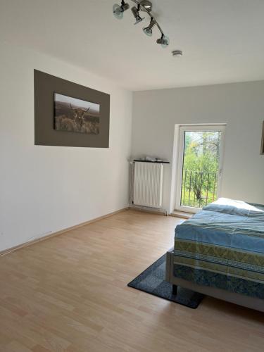 Кровать или кровати в номере Diershof Walsrode