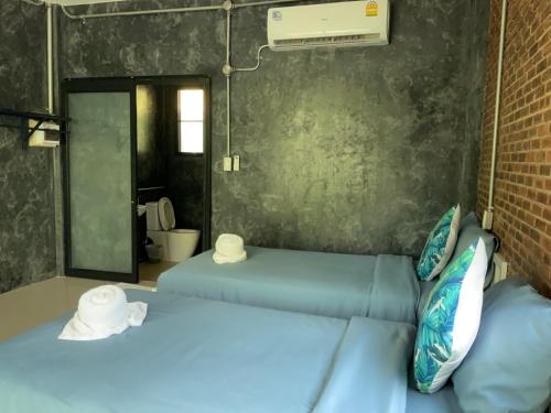 Postel nebo postele na pokoji v ubytování Baan Tonjaeng Resort