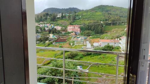a view from a window of a city at Royal Serene Villas in Ooty