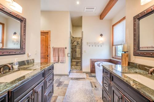 a bathroom with two sinks and a shower at Casa Del Colorado in Pagosa Springs