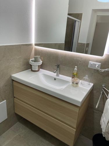 a bathroom with a white sink and a mirror at Matty's in Olbia