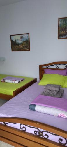 two beds sitting next to each other in a room at Ilio Socrates in Skala Marion