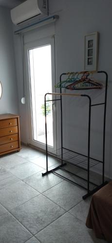 a bedroom with a bunk bed and a window at Ilio Socrates in Skala Marion