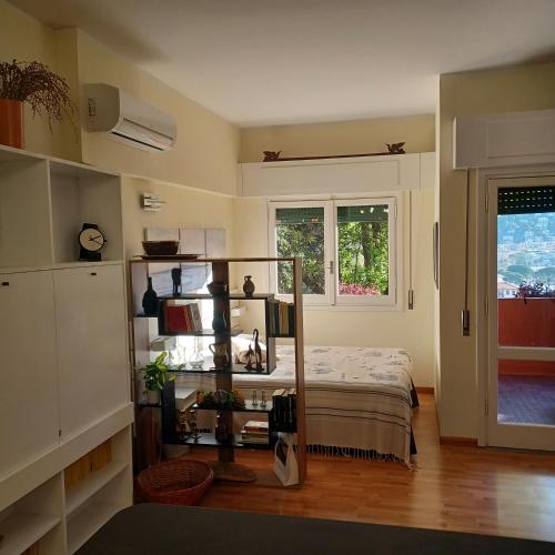 a bedroom with a bed and a book shelf at Loggia Portofino in Rapallo