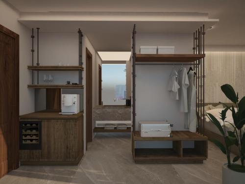 a kitchen with a sink, a refrigerator, and a window at Assano Seafront Luxury in Nikiti