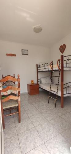 a room with two bunk beds in a room at Kostas Apartments in Kourouta