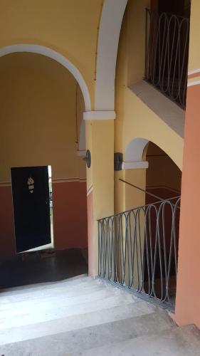 a building with a gate and a balcony at nel centro storico casa vacanze I Mughetti in Citta' Sant'Angelo