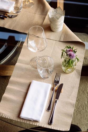 a table with a napkin and glasses on a table at Il Fiorile in Borghetto Di Borbera