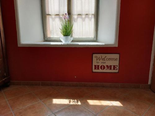 a window with a welcome to our home sign in a room at Soča House Tolmin in Tolmin