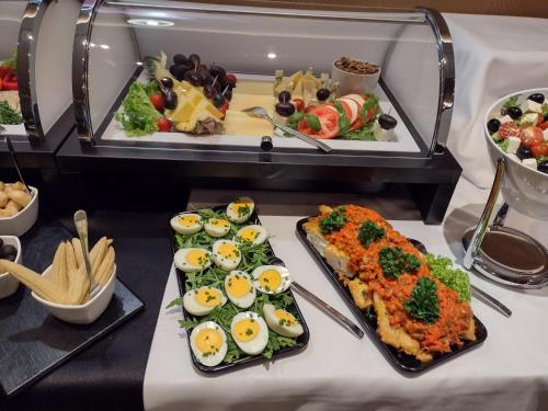 a buffet of food with eggs and vegetables at Złote Arkady in Częstochowa