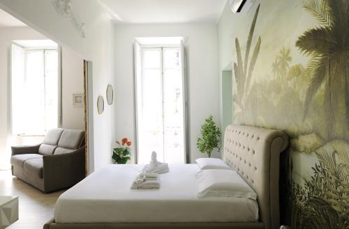 En eller flere senge i et værelse på Apartments Chic Torino Centro