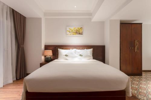 Cochin Sang Hotelにあるベッド