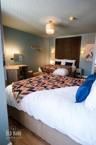 a hotel room with two beds in a room at The Old Bank Apartments in Blackpool