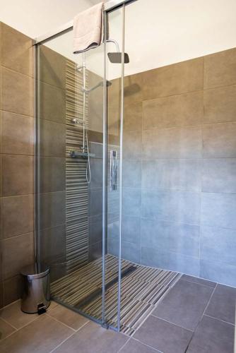 a shower with a glass door in a bathroom at Luxury Apartment Monte Carlo in Pörtschach am Wörthersee