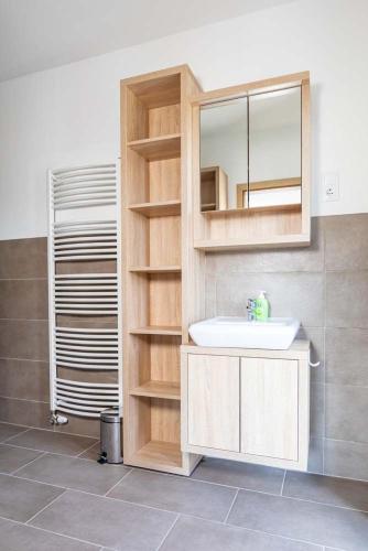 a bathroom with a sink and a mirror at Luxury Apartment Monte Carlo in Pörtschach am Wörthersee