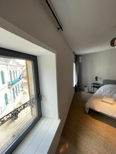 Säng eller sängar i ett rum på Laboutique2