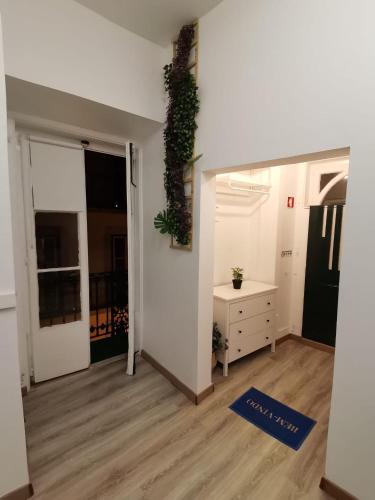 a living room with a door open to a bedroom at Party Zone in Lisbon