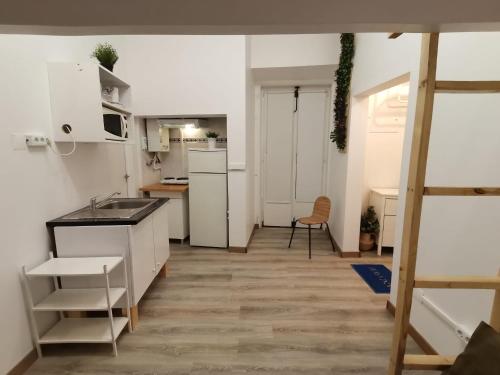 a small kitchen with a sink and a counter at Party Zone in Lisbon