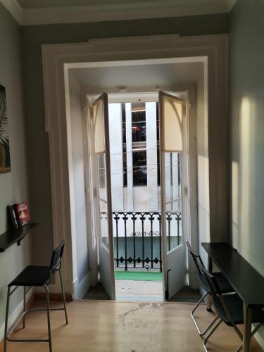 an open door with a view of a balcony at Party Zone in Lisbon