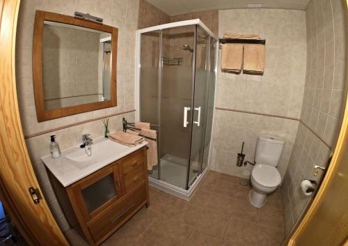 a bathroom with a shower and a sink and a toilet at Casa Rural Guadiela in San Pedro Palmiches