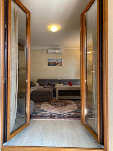 a living room with a couch and a large mirror at Villa Eva Karigador in Novigrad Istria