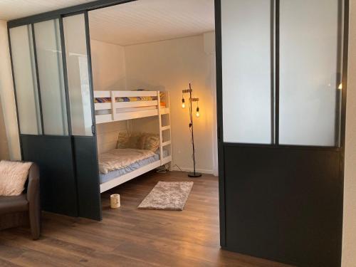 a room with two bunk beds and a closet at Résidence Plambramois in Crans-Montana