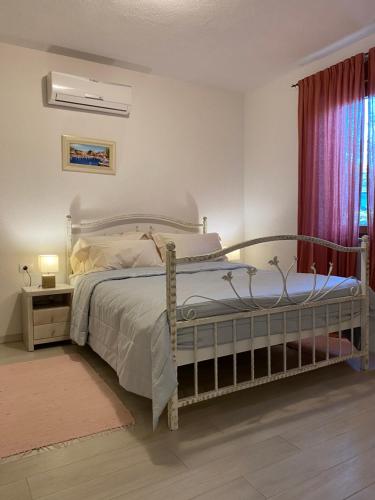 Кровать или кровати в номере Villa Eva Karigador