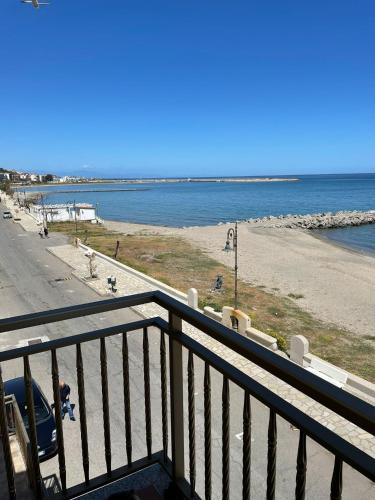 a view of a beach from a balcony at Olga’s house in Cariati